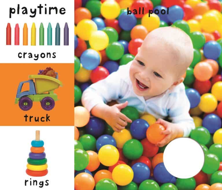 Baby playing in a colorful ball pit with illustrations of crayons, a toy truck, and stacking rings on the side.