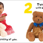 A baby smiles holding a teddy bear; next are two teddy bears with blue bows.